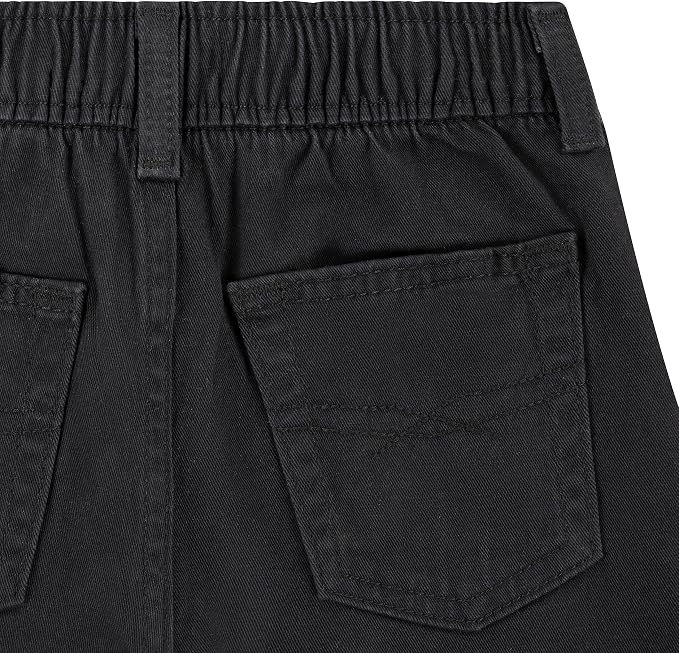 Close-up of the back waistband and right back pocket of black denim shorts, showing the elasticized waist and stitched pocket details.